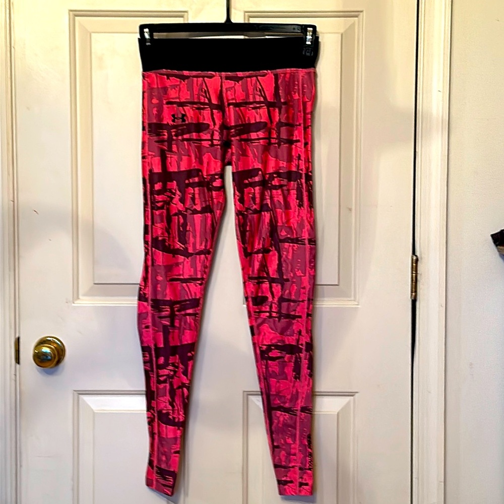 Woman’s Under Armor pink and black athletic leggings